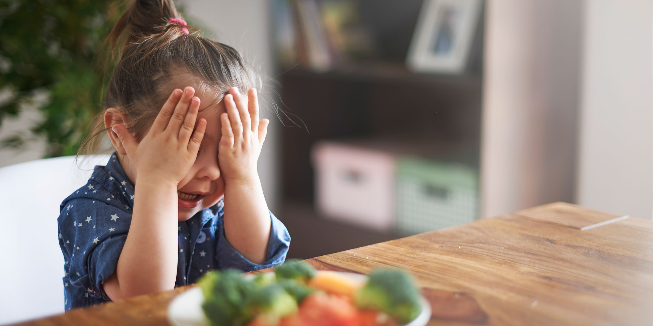 Little girl at the dinner table