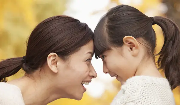 Mother and daughter looking at each other